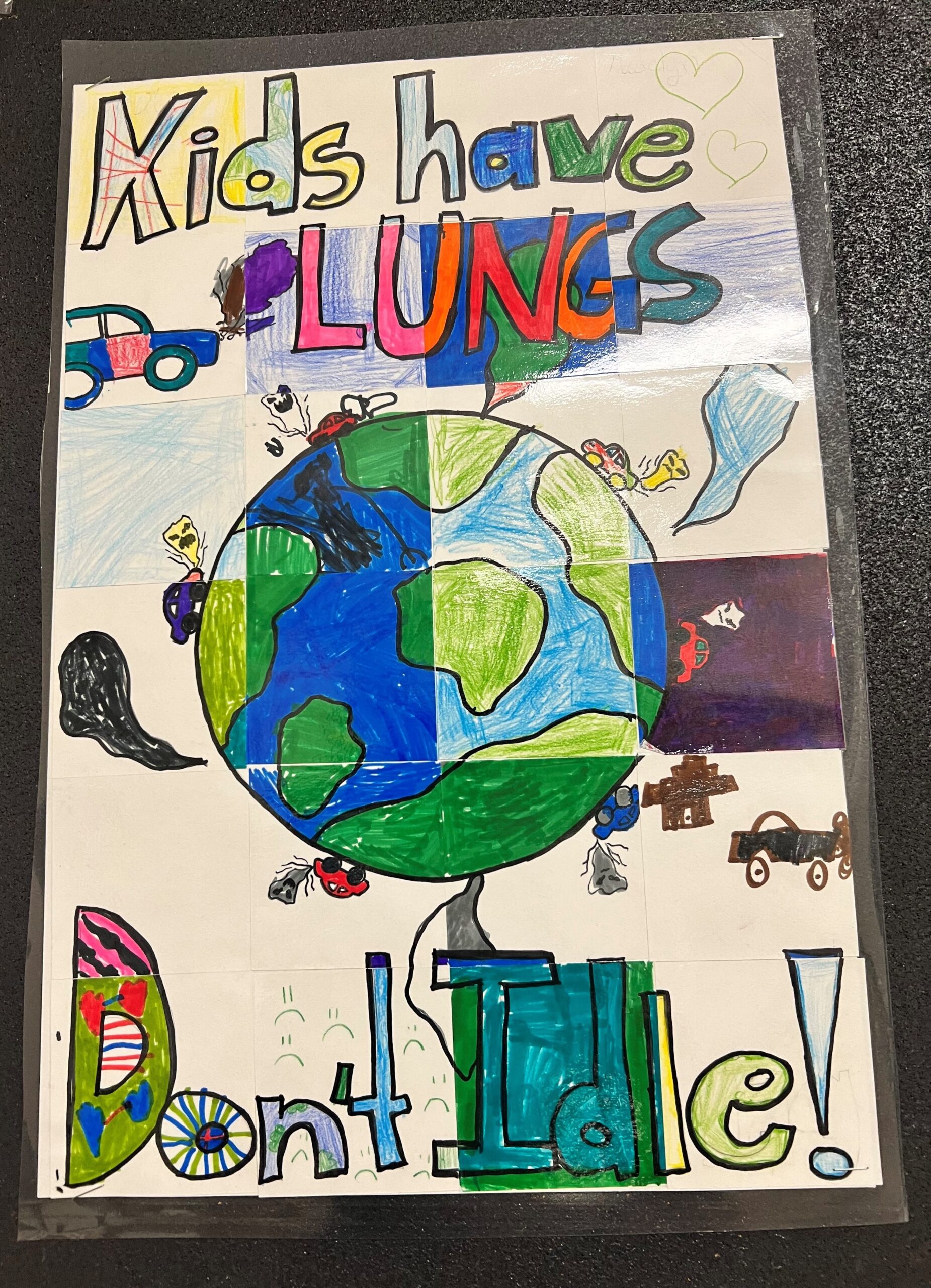A children's poster that says Kids Have Lungs Don't Idle